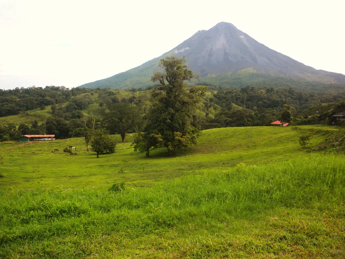 The Arenal volcano seen clear from the northeast above rainforest near the La Fortuna hot springs in Costa Rica